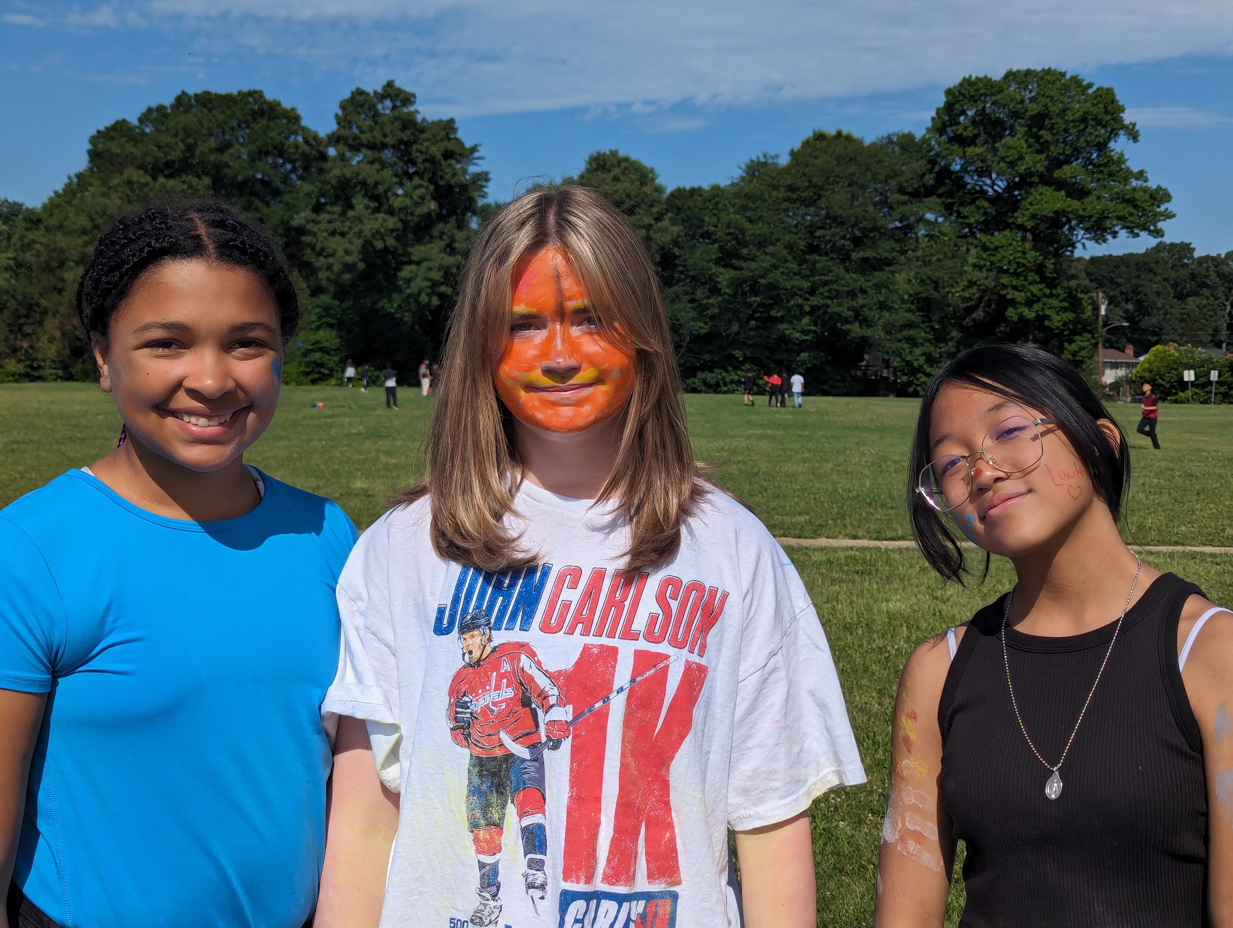 three students with face paint